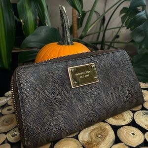 MK large monogram quarter zip jet set wallet